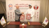 QFA President Sheikh Hamad bin Khalifa bin Ahmed Al Thani and President of the Cuban Football Association Oliet Rodriguez shake hands after the signing ceremony.