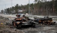 A destroyed Russian tank is seen on a highway, as Russia's attack on Ukraine continues, in Kyiv region, Ukraine, April 5, 2022. REUTERS/Gleb Garanic
