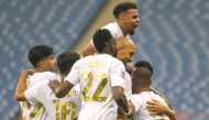 Al Rayyan players celebrate with Yohan Boli after the Ivorian scored his second goal, yesterday.