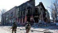 Service members of pro-Russian troops inspect streets during Ukraine-Russia conflict in the southern port city of Mariupol, Ukraine April 7, 2022. Reuters/Alexander Ermochenko/File Photo
