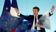 French President Emmanuel Macron, candidate for his re-election, reacts on stage after partial results in the first round of the 2022 French presidential election, in Paris, France, April 10, 2022. REUTERS/Benoit Tessier