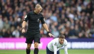 April 9, 2022 Tottenham Hotspur's Matt Doherty goes down as the referee Graham Scott looks on Action Images via Reuters/Molly Darlington