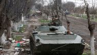 Service members of pro-Russian troops ride an armoured vehicle during fighting in Ukraine-Russia conflict near a plant of Azovstal Iron and Steel Works company in the southern port city of Mariupol, Ukraine April 12, 2022. Reuters/Alexander Ermochenko