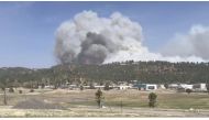Smoke rises as a wind-driven wildfire, known as the McBride Fire, is seen burning on a ridge in Ruidoso, New Mexico, U.S. in this still image taken from a video obtained from social media April 12, 2022. Video taken April 12, 2022. Courtesy Melissa Gibbs/via REUTERS