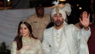 Bollywood actors Alia Bhatt and Ranbir Kapoor greet the media during a photo-op after their wedding function in Mumbai, India, April 14, 2022. REUTERS/Francis Mascarenhas