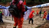 Rescue workers work at the site where a China Eastern Airlines Boeing 737-800 plane flying from Kunming to Guangzhou crashed, in Wuzhou, Guangxi Zhuang Autonomous Region, China March 24, 2022. REUTERS/Carlos Garcia Rawlins/File Photo