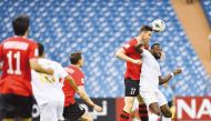 Al Rayyan’s Yohan Boli (right) and Istiklol’s Uladzislaw Kasmynin vie for the ball during the AFC Champions League group stage match in Riyadh yesterday.