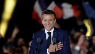 French President Emmanuel Macron gestures as he arrives to deliver a speech after being re-elected as president, following the results in the second round of the 2022 French presidential election, during his victory rally at the Champs de Mars in Paris, France, April 24, 2022. REUTERS/Benoit Tessier 