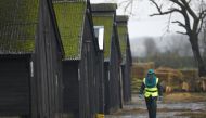 An official walks through a duck farm in Nafferton, northern England November 18, 2014.


