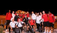 Al Duhail players and officials pose for a group photo ahead of their departure for Doha. 