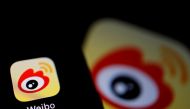 The logo of Chinese social media app Weibo is seen on a mobile phone in this illustration picture taken December 7, 2021. REUTERS/Florence Lo/Illustration/File Photo