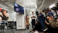 FILE PHOTO: Members of the media watch an animated presentation re-enactment of the accident with Halyna Hutchins, who was accidentally shot dead by actor Alec Baldwin, in Los Angeles, California, U.S., February 15, 2022. REUTERS/Mario Anzuoni/File Photo
