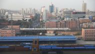 Freight cars are seen at a train station in Dandong, Liaoning province, China April 21, 2021. REUTERS/Tingshu Wang

