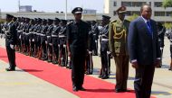 Kenya's President Uhuru Kenyatta (R) inspects a guard of honor outside the parliament building in Uganda's capital Kampala, August 10, 2015, before addressing legislators as part of his three-day state visit. REUTERS/James Akena/File Photo
 