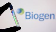 A test tube is seen in front of displayed Biogen logo in this illustration taken, December 1, 2021. REUTERS/Dado Ruvic/Illustration/File Photo