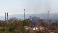 Smoke rises above a plant of Azovstal Iron and Steel Works during Ukraine-Russia conflict in the southern port city of Mariupol, Ukraine May 3, 2022. REUTERS/Alexander Ermochenko
