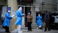 File photo: Residents line up for nucleic acid tests during lockdown, amid the coronavirus disease (COVID-19) pandemic, in Shanghai, China, April 30, 2022. Reuters/Aly Song/File Photo
