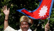 Kami Rita Sherpa, a Nepali mountaineer, waves towards media in Kathmandu, Nepal May 25, 2019. Kami Rita summited Mount Everest on May 7, 2022, for a record 26th time, beating his own record set last year, REUTERS/Navesh Chitrakar/File Photo