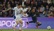 Troyes' Giulian Biancone in action with Paris St Germain's Neymar REUTERS/Gonzalo Fuentes
