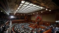 Empty seats are seen as lawmakers practice social distancing, during Japan's Prime Minister Yoshihide Suga's policy speech at the opening of the Lower House parliamentary session in Tokyo, Japan January 18, 2021. REUTERS/Issei Kato

