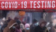 People queue to be tested for COVID-19 in Times Square, as the Omicron coronavirus variant continues to spread in Manhattan, New York City, U.S., December 20, 2021. REUTERS/Andrew Kelly/File Photo

