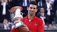  Serbia's Novak Djokovic celebrates with the trophy after winning the final against Greece's Stefanos Tsitsipas REUTERS/Guglielmo Mangiapane