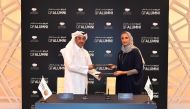 The Minister of Labour H E  Dr. Ali bin Smaikh Al Marri and Vice-Chairperson and CEO of Qatar Foundation H E Sheikha Hind bint Hamad Al Thani exchanging the signed documents.
