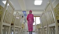 A worker disinfects a dining room at a sanitary supplies factory, amid growing fears over the spread of the coronavirus disease (COVID-19), in Pyongyang, North Korea, in this photo taken on May 16, 2022 and released by Kyodo on May 17, 2022. Mandatory credit Kyodo/via REUTERS