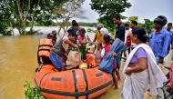 People disembark a boat after they were evacuated from a flooded village in Nagaon district, in the northeastern state of Assam, India, May 18, 2022. REUTERS/Anuwar Hazarika