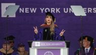 Singer Taylor Swift gestures while speaking after receiving her Honorary Doctorate in Fine Arts during the New York University (NYU) graduation ceremony at Yankee Stadium in the Bronx borough of New York City, New York, U.S., May 18, 2022. REUTERS/Shannon Stapleton