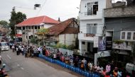People wait in a line to buy domestic gas tanks near a distributor, amid the country's economic crisis, in Colombo, Sri Lanka, May 24, 2022. Reuters/Dinuka Liyanawatte