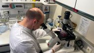 Head of the Institute of Microbiology of the German Armed Forces Roman Woelfel works in his laboraty in Munich, May 20, 2022, after Germany has detected its first case of monkeypox. REUTERS/Christine Uyanik

