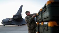 File photo: A Ukrainian service member unloads Lithuania's military aid including Stinger anti-aircraft missiles, delivered as part of the security support package for Ukraine by a 17 Globemaster III plane, at the Boryspil International Airport outside Kyiv, Ukraine, February 13, 2022. REUTERS