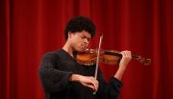 Violinist Braimah Kanneh-Mason plays the rare 'Hellier' violin. Reuters/Henry Nicholls