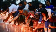 Members of Sommilito Sangskritik Jote organisation participate in a candlelight vigil in remembrance of the victims of the fire that broke out in an inland container depot in Sitakunda, in Dhaka, Bangladesh, June 6, 2022. Reuters/Mohammad Ponir Hossain