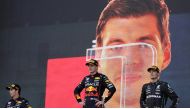 Red Bull's Max Verstappen celebrates on the podium after winning the race alongside second place Red Bull's Sergio Perez and third place Mercedes' George Russell REUTERS/Leonhard Foeger
