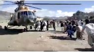 People carry injured to a helicopter following a massive earthquake, in Paktika Province, Afghanistan, June 22, 2022, in this screen grab taken from a video. Bakhtar News Agency/Handout via Reuters