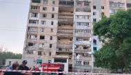 Bodies of civilian people killed by a Russian missile strike are seen in front of a damaged residential building, as Russia's attack on Ukraine continues, in the village of Serhiivka, Odesa region, Ukraine July 1, 2022. Press service of the State Emergency Service of Ukraine/Handout via REUTERS