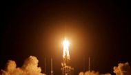 FILE PHOTO: The Long March-5 Y5 rocket, carrying the Chang'e-5 lunar probe, takes off from Wenchang Space Launch Center, in Wenchang, Hainan province, China November 24, 2020. REUTERS/Tingshu Wang