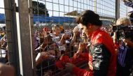 Ferrari's Carlos Sainz Jr. with fans after the race. (Reuters/Andrew Boyers)