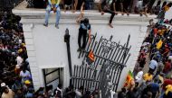 Demonstrators protest inside the President's House premises, after President Gotabaya Rajapaksa fled, amid the country's economic crisis, in Colombo, Sri Lanka, July 9, 2022. REUTERS/Dinuka Liyanawatte