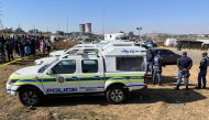 Police cordon off the scene where 15 people were killed by unknown gunmen inside a tavern, in Nomzamo, Soweto, Johannesburg, South Africa, July 10, 2022. (REUTERS/Siyabonga Sishi)