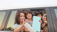  Kids enjoy receiving gifts called Eidiya at Katara.