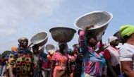 FILE PHOTO: Head porters march in the streets on the second day of protests over recent economic hardships, in Accra, Ghana, June 29, 2022. REUTERS/Francis Kokoroko/File Photo
