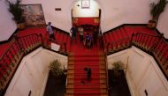 A man sweeps the stairs inside the President's house after President Gotabaya Rajapaksa fled, amid the country's economic crisis, in Colombo, Sri Lanka July 14, 2022. REUTERS/Adnan Abidi