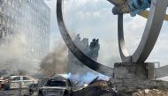 Destroyed vehicles are seen near a monument at the site of a Russian military strike, as Russia's attack on Ukraine continues, in Vinnytsia, Ukraine, July 14, 2022. (Reuters)

