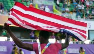 Athletics - World Athletics Championships - Men's 100 Metres - Final - Hayward Field, Eugene, Oregon, U.S. - July 16, 2022 Gold medallist Fred Kerley of the U.S. celebrates after winning the men's 100 metres final REUTERS/Aleksandra Szmigiel