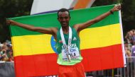 Ethiopia's Tamirat Tola celebrates winning the men's marathon and setting a new world championship record at the World Athletics Championships (Men's Marathon) in Eugene, Oregon, US, July 17, 2022. (REUTERS/Brian Snyder)
