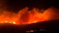 A wildfire burns in Ntrafi, near Athens, Greece July 20, 2022. REUTERS/Giorgos Moutafis