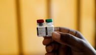 A nurse holds malaria vaccine vials at the Lumumba Sub-County hospital in Kisumu, Kenya, July 1, 2022. (REUTERS/Baz Ratner)